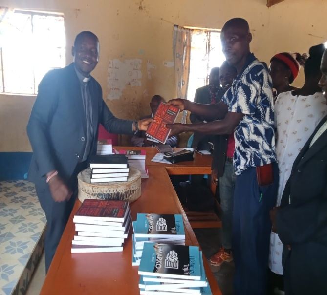 Bible donation handover to a church leader