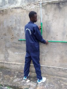 Daniel Muthoka pipe fitting at wall