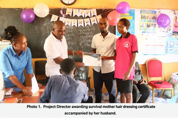 Project Director awarding hair dressing certificate to a survival mother