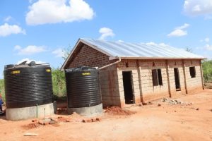 Maeni classroom building with water tanks