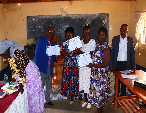 Close-up of certificate being awarded to a church leader