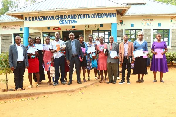 Church leaders with certificates at AIC Kanzinwa CYDC