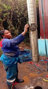 Wayua Karumba installing Grundfos water pump